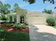 Attractive home with a well-maintained lawn and an attached two-car garage at 2312 Twickingham Ct, Clermont, FL 34711