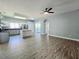 Open-concept living area with a well-appointed kitchen and adjacent dining space at 2312 Twickingham Ct, Clermont, FL 34711