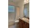Clean bathroom with a tub and shower combination, vanity, and ample lighting, offering a functional space at 2495 Palm Tree Dr, Kissimmee, FL 34759