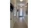 Tiled foyer with a decorative glass front door, coat closet and decor for a welcoming entryway at 2495 Palm Tree Dr, Kissimmee, FL 34759