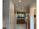 Open kitchen featuring wood cabinets, stainless steel appliances and an eat-in counter at 2495 Palm Tree Dr, Kissimmee, FL 34759