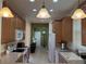 Spacious kitchen featuring a breakfast bar and stainless steel appliances with access to dining area at 2495 Palm Tree Dr, Kissimmee, FL 34759