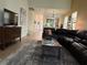 Inviting living room with a large sectional sofa and wood-style floors, perfect for relaxation and entertainment at 2495 Palm Tree Dr, Kissimmee, FL 34759