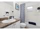 The bathroom includes a shower and tub combination and a modern vanity at 252 Barbera Dr, Davenport, FL 33897