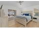 Spacious bedroom features a king bed, light wood floors, and access to outdoor patio at 252 Barbera Dr, Davenport, FL 33897
