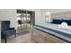 Bedroom suite with king bed and outdoor access, plus seating area at 252 Barbera Dr, Davenport, FL 33897