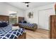 This bedroom features two beds, blue-themed bedding, and a minimalist design at 252 Barbera Dr, Davenport, FL 33897