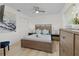 Cozy bedroom with a ceiling fan, a large bed, and a stylish accent wall art at 252 Barbera Dr, Davenport, FL 33897