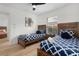 This bedroom includes two twin beds, each with sleek wooden frames and stylish bedding at 252 Barbera Dr, Davenport, FL 33897