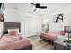 Bright bedroom with two twin beds, ceiling fan, contemporary decor, and a view from the window at 252 Barbera Dr, Davenport, FL 33897
