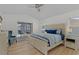 Inviting bedroom offers a king size bed and access to the outdoor patio and pool at 252 Barbera Dr, Davenport, FL 33897