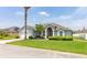 Charming single-story home featuring a two-car garage, manicured lawn, and beautiful landscaping at 252 Barbera Dr, Davenport, FL 33897