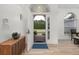 Bright foyer showcasing a light wood floor and arched entry with decor at 252 Barbera Dr, Davenport, FL 33897