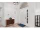 Bright foyer showcasing a light wood floor and arched entry with decor at 252 Barbera Dr, Davenport, FL 33897