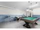 This expansive game room includes a pool table and seating for entertainment at 252 Barbera Dr, Davenport, FL 33897