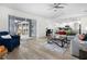 Open-concept living space with a view of the patio, stylish seating, and a seamless transition to the kitchen area at 252 Barbera Dr, Davenport, FL 33897