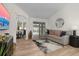 Comfortable living room featuring wood floors, sliding glass doors, and a view of the pool at 252 Barbera Dr, Davenport, FL 33897