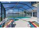 Outdoor pool, spa, lounge chairs, and ample patio space at 252 Barbera Dr, Davenport, FL 33897