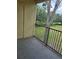 Balcony with black metal railing and view of the lawn at 2572 Robert Trent Jones Dr # 1227, Orlando, FL 32835