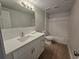 Neutral bathroom with white vanity, updated fixtures, tile flooring, and tub/shower combo at 2572 Robert Trent Jones Dr # 1227, Orlando, FL 32835