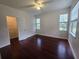 Bright bedroom with hardwood floors, ceiling fan and a walk-in closet at 2572 Robert Trent Jones Dr # 1227, Orlando, FL 32835