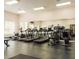 Fitness center with treadmills, exercise machines and full length mirror at 2572 Robert Trent Jones Dr # 1227, Orlando, FL 32835