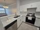 Well-equipped kitchen featuring stainless steel appliances and quartz countertops at 2572 Robert Trent Jones Dr # 1227, Orlando, FL 32835