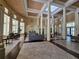 Spacious lobby with high ceilings, multiple seating areas, and abundant natural light at 2572 Robert Trent Jones Dr # 1227, Orlando, FL 32835