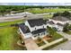 Scenic aerial view of a two-story home with a front porch, nestled within a lush green landscape at 2616 Marg Ln, Kissimmee, FL 34758