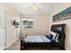 This bedroom features a sleek black bed frame and a wall-mounted TV at 2616 Marg Ln, Kissimmee, FL 34758