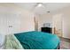 Bright bedroom features ceiling fan, closet, and ensuite bathroom for added convenience at 2616 Marg Ln, Kissimmee, FL 34758