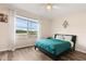 Bedroom featuring wood floors, neutral color scheme, and large window at 2616 Marg Ln, Kissimmee, FL 34758