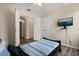 Bedroom with a sleek bed frame and a wall-mounted TV at 2616 Marg Ln, Kissimmee, FL 34758
