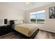 Bedroom includes a large window offering natural light and views of the outdoors at 2616 Marg Ln, Kissimmee, FL 34758