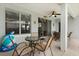Covered patio area with outdoor seating, perfect for al fresco dining and relaxing, next to fun inflatables at 2616 Marg Ln, Kissimmee, FL 34758