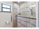 Modern bathroom featuring tiled shower, granite accents, and accessibility features at 2740 Barker Rd, St Cloud, FL 34771