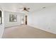 Bright bedroom featuring neutral carpet and a sliding glass door to the outside at 2740 Barker Rd, St Cloud, FL 34771
