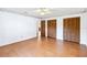 Bedroom with wood-look floors and and closets at 2740 Barker Rd, St Cloud, FL 34771