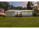 Charming single-story home with a metal roof and well-maintained lawn at 2740 Barker Rd, St Cloud, FL 34771