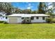 Charming single-story home with a metal roof and well-maintained lawn at 2740 Barker Rd, St Cloud, FL 34771