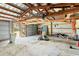 Spacious garage interior with high ceilings, multiple bays, and ample storage space at 2740 Barker Rd, St Cloud, FL 34771