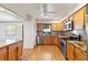 Charming kitchen with wooden cabinets, stainless steel appliances, and granite countertops at 2740 Barker Rd, St Cloud, FL 34771