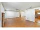 Spacious living room featuring hardwood floors, and the open layout seamlessly flows into the kitchen area at 2740 Barker Rd, St Cloud, FL 34771