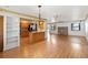 Spacious living room featuring hardwood floors, recessed lighting, and an open concept to the kitchen at 2740 Barker Rd, St Cloud, FL 34771