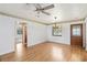 Bright and airy living room with hardwood floors and doorway that provides flow throughout the home at 2740 Barker Rd, St Cloud, FL 34771