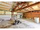 Large shed with metal roof, wood supports, work bench, and storage cabinets at 2740 Barker Rd, St Cloud, FL 34771
