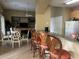 Spacious community room with bar seating, dining area, and cozy living space for residents at 4008 San Gallo Dr # 106, Kissimmee, FL 34741