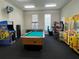 Game room featuring a pool table, crane games, and other arcade games at 4008 San Gallo Dr # 106, Kissimmee, FL 34741