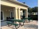 Outdoor patio with picnic tables, perfect for gatherings and enjoying the fresh air at 4008 San Gallo Dr # 106, Kissimmee, FL 34741
