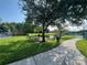 Shaded community picnic area by the pond and tennis courts at 4008 San Gallo Dr # 106, Kissimmee, FL 34741